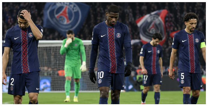 PSG players walking off the pitch after a difficult Ligue 1 match.